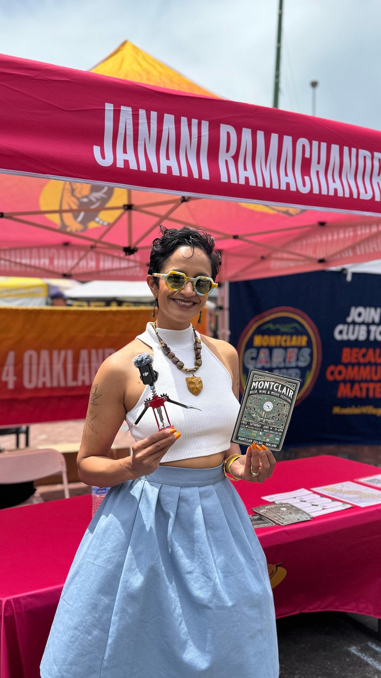 Janani in front of booth in Montclair