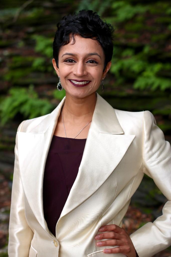 Professional headshot of Janani Ramachandran in a cream blazer